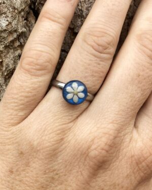 sesame seeds and mustard seed ring on blue
