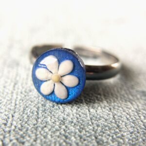 sesame seeds and mustard seed earrings on blue