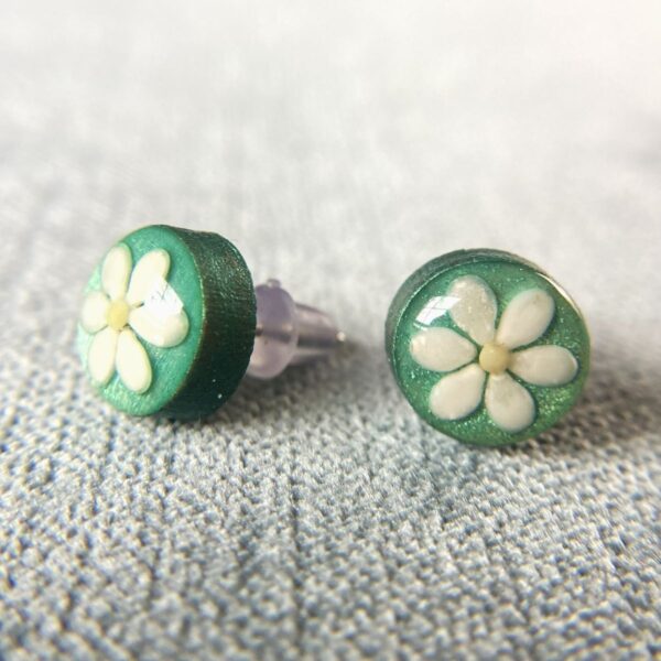 sesame seeds and mustard seed earrings on green