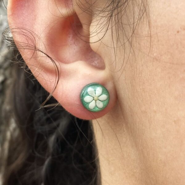 sesame seeds and mustard seed earrings on green