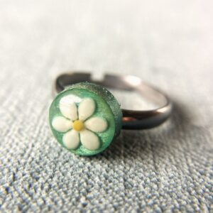 sesame seeds and mustard seed earrings on green