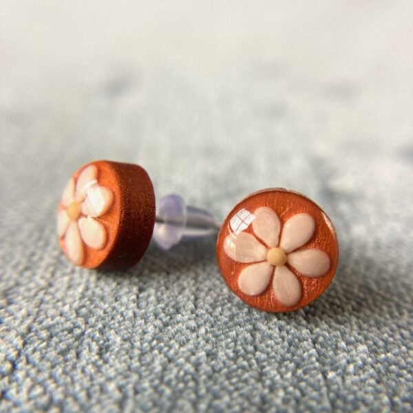 sesame seeds and mustard seed earrings on orange