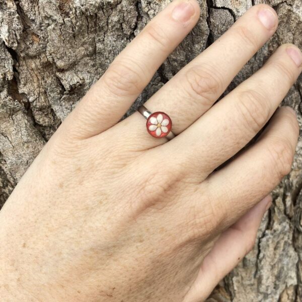 sesame seeds and mustard seed ring on red