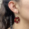 red corn earrings on model