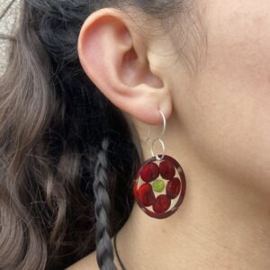 red corn earrings on model