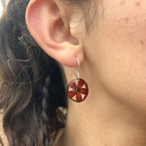 small red corn earrings on model